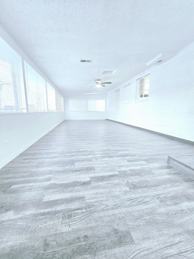 unfurnished room with a textured ceiling