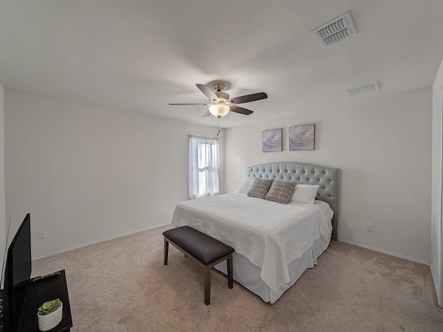 bedroom with ceiling fan and light colored carpet