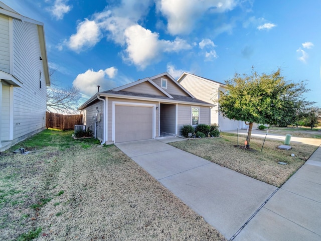 view of front of home with central AC unit, a garage, and a front lawn