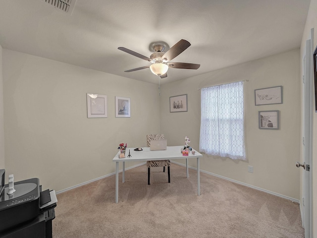 carpeted office with ceiling fan