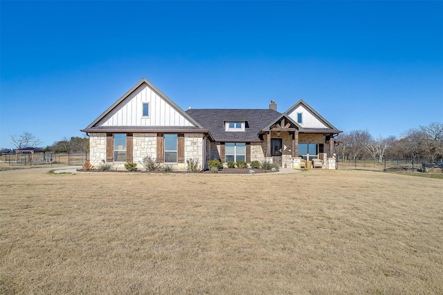 craftsman-style home featuring a front yard