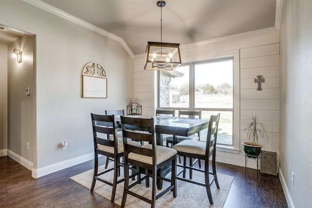 dining room with crown molding, dark wood-type flooring, and lofted ceiling