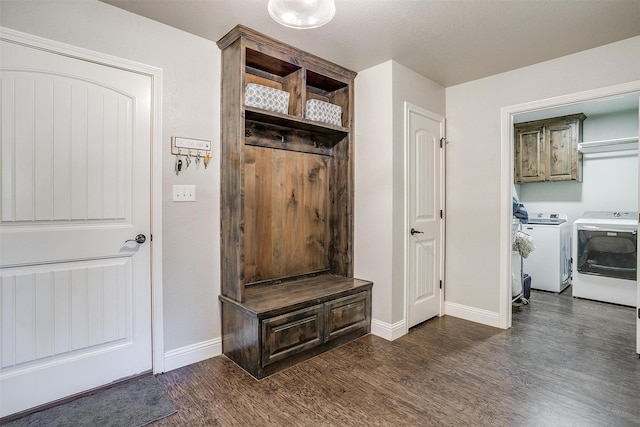 mudroom with dark wood-type flooring and washer and dryer