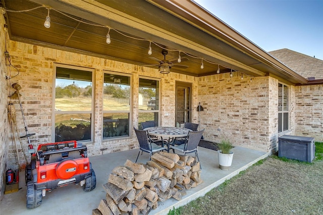 view of patio featuring ceiling fan