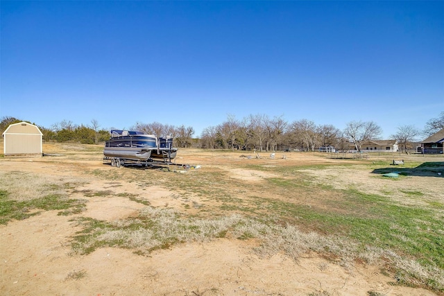 view of yard with a shed