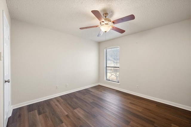 empty room with a textured ceiling, ceiling fan, and dark wood-type flooring