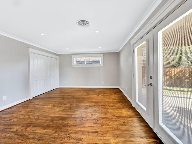 unfurnished room with dark hardwood / wood-style flooring, ornamental molding, and french doors