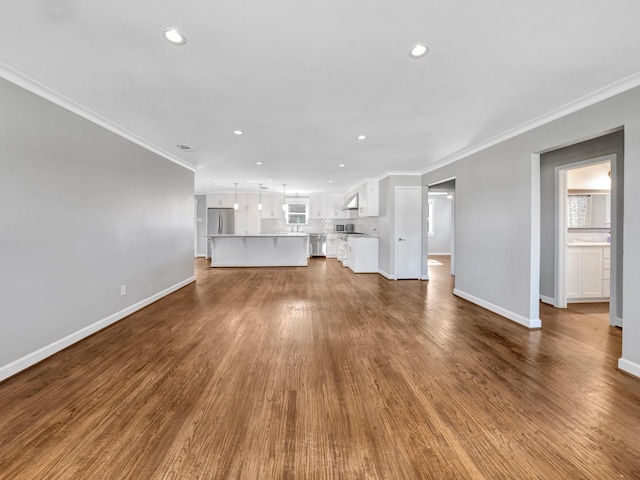 unfurnished living room featuring wood-type flooring and crown molding