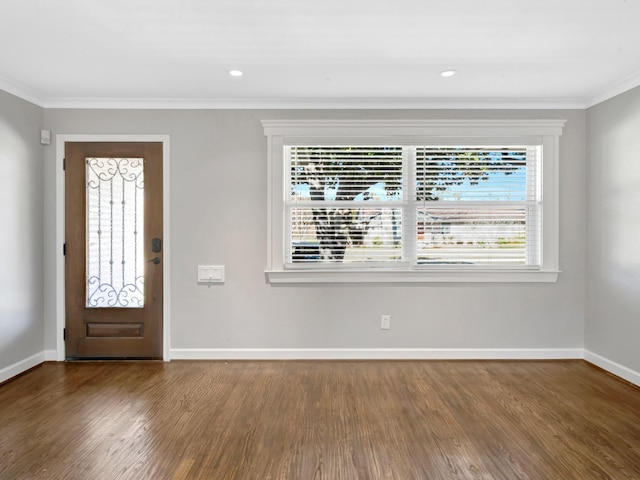 entrance foyer with crown molding and hardwood / wood-style floors