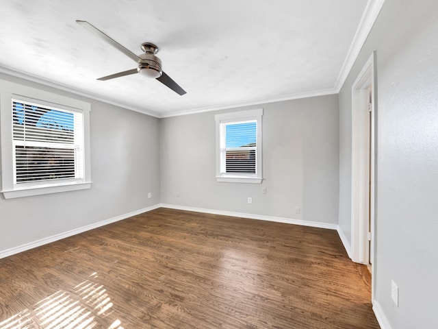 empty room featuring dark hardwood / wood-style floors, ceiling fan, and crown molding