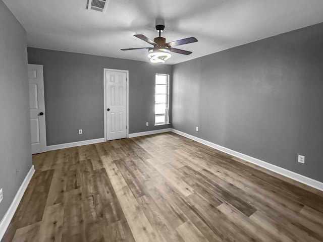 unfurnished bedroom featuring ceiling fan and wood-type flooring