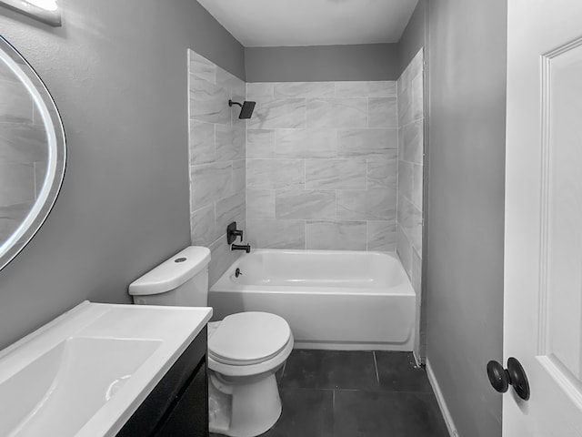 full bathroom with toilet, tiled shower / bath combo, tile patterned floors, and vanity