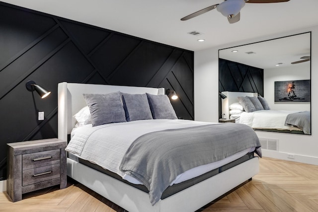 bedroom with ceiling fan and light parquet flooring