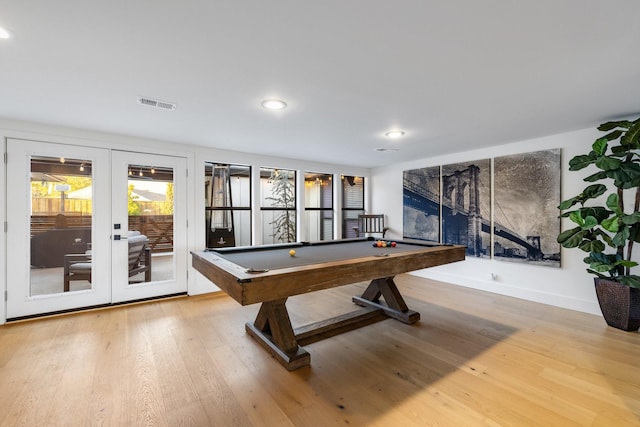 game room featuring light hardwood / wood-style floors, french doors, and billiards