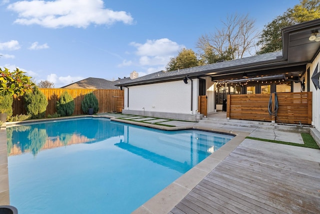 view of pool featuring a wooden deck