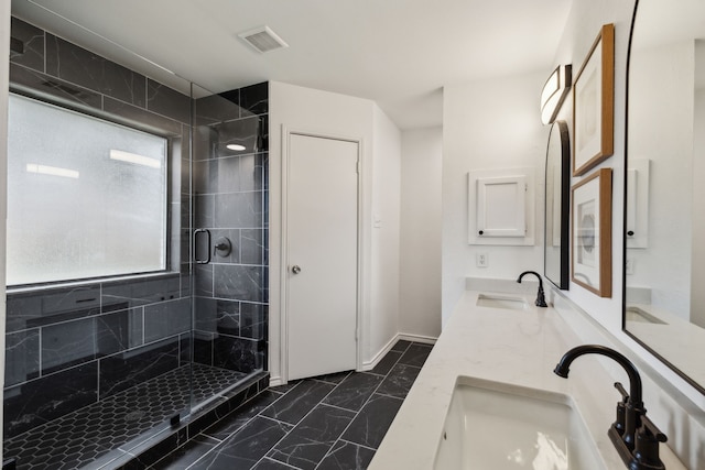 bathroom with vanity and an enclosed shower