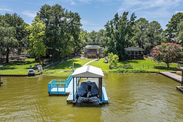 view of dock featuring a yard and a water view