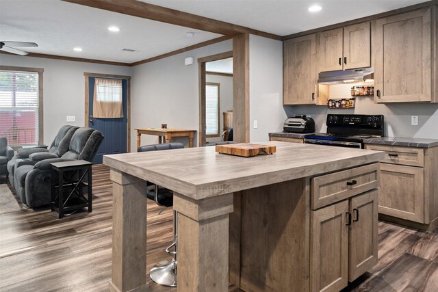 kitchen with a center island, crown molding, ceiling fan, black / electric stove, and dark hardwood / wood-style flooring