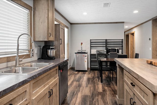 kitchen with dark wood-type flooring, sink, stainless steel appliances, and ornamental molding