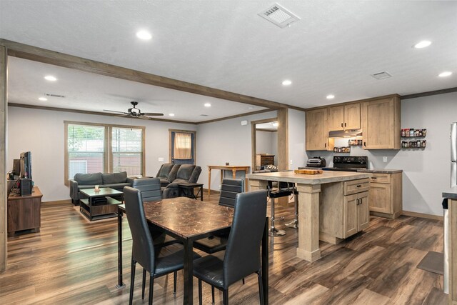 dining space featuring beam ceiling, ceiling fan, crown molding, and dark hardwood / wood-style floors