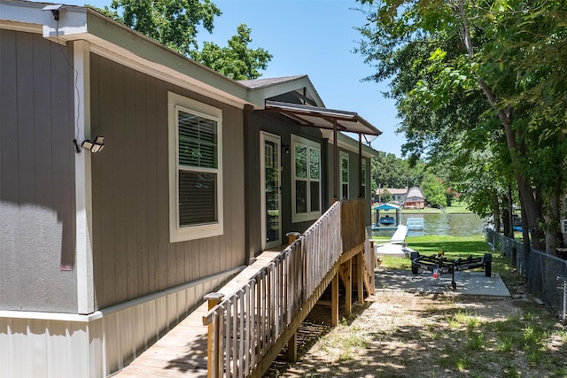 view of side of home with a patio area