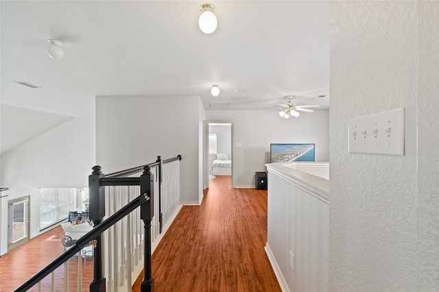 corridor with hardwood / wood-style floors