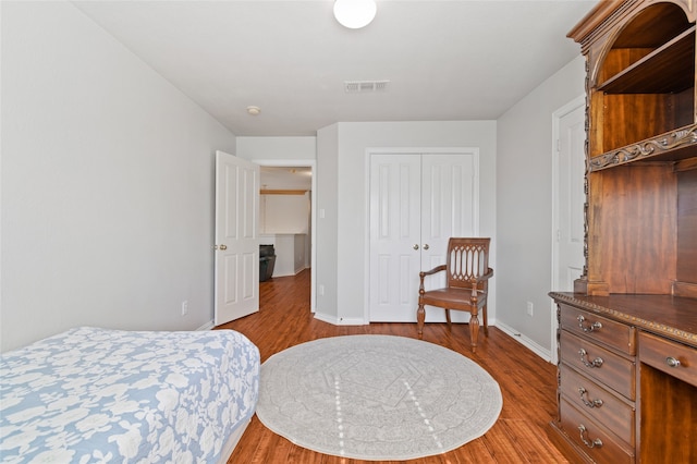 bedroom featuring a closet and wood-type flooring