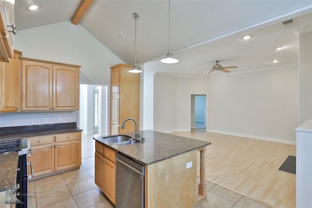 kitchen featuring ceiling fan, sink, hanging light fixtures, a kitchen island with sink, and appliances with stainless steel finishes