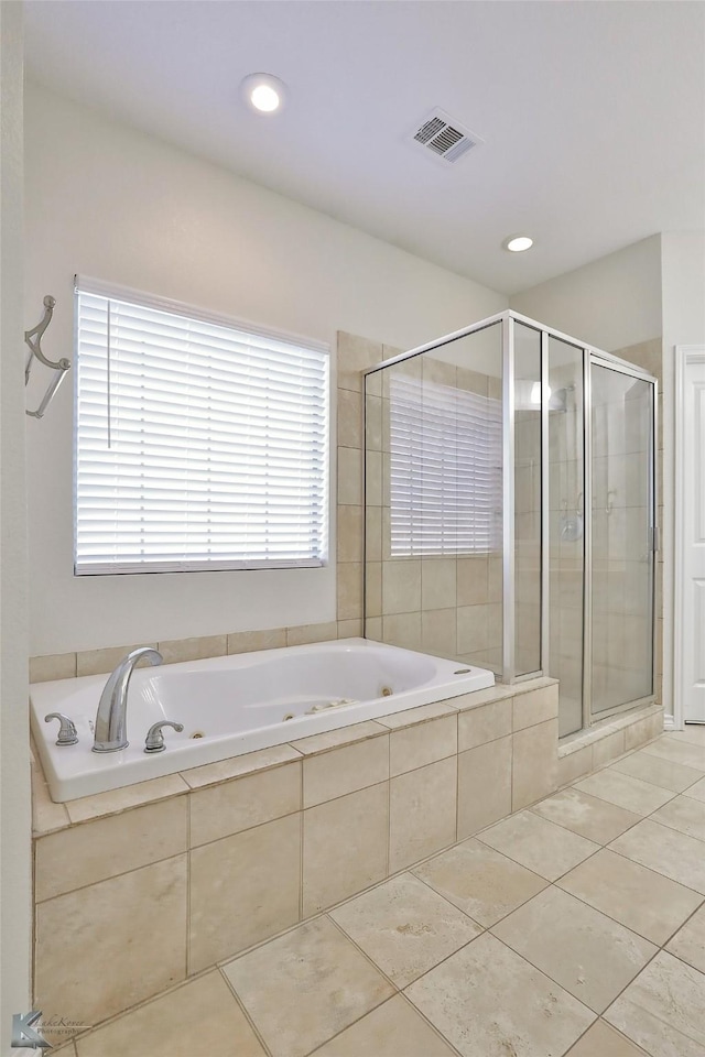 bathroom featuring tile patterned flooring and shower with separate bathtub