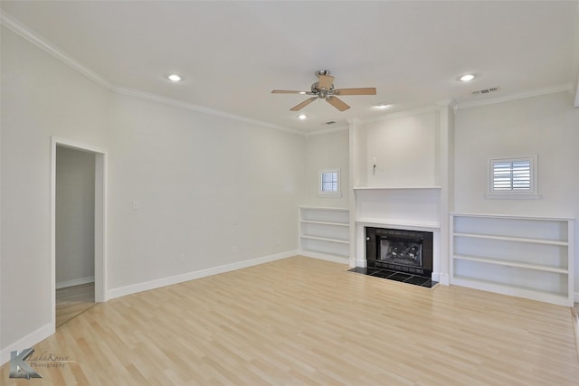 unfurnished living room featuring ceiling fan, built in features, light hardwood / wood-style floors, and ornamental molding