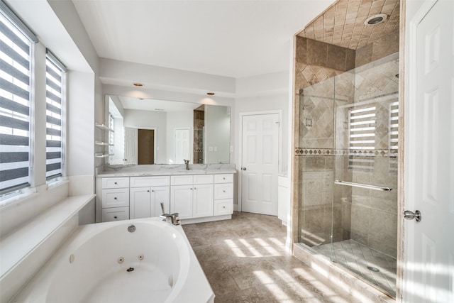 bathroom featuring vanity and shower with separate bathtub