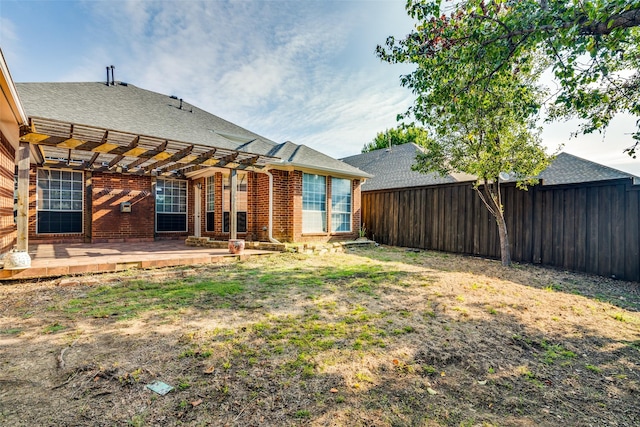 view of yard with a pergola and a patio