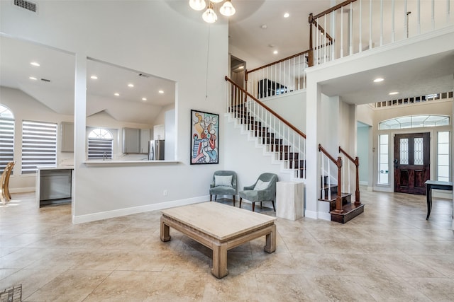 living room with high vaulted ceiling