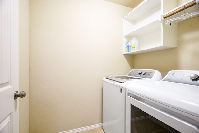 laundry room featuring washing machine and clothes dryer