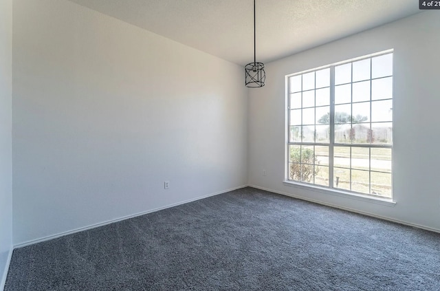 empty room featuring dark carpet