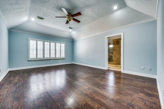 empty room with a textured ceiling, dark hardwood / wood-style floors, ceiling fan, and lofted ceiling