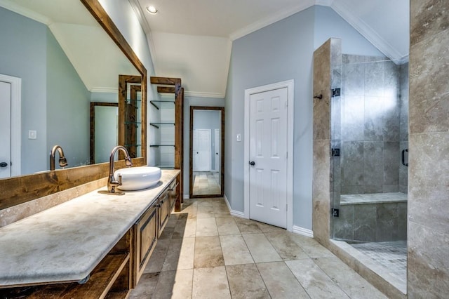 bathroom featuring vanity, vaulted ceiling, a shower with door, and crown molding