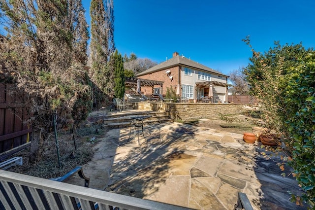 view of yard featuring a pergola and a patio