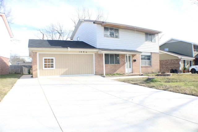 front of property with a garage and a front lawn