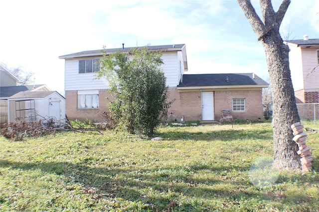 rear view of house with a yard