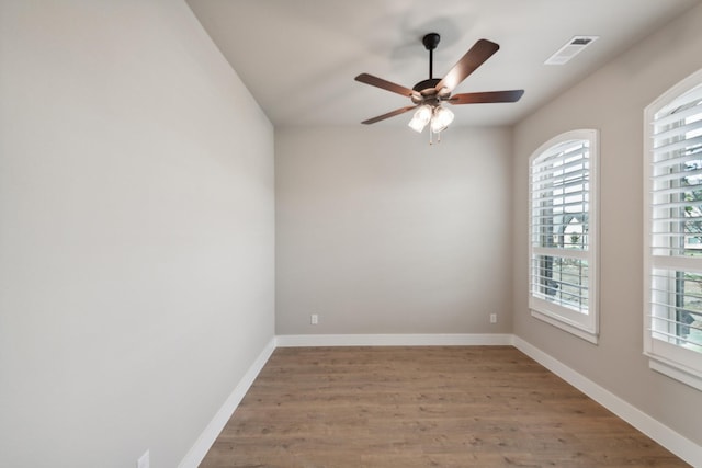 empty room featuring ceiling fan and wood-type flooring