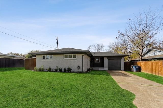 ranch-style house featuring a garage and a front lawn