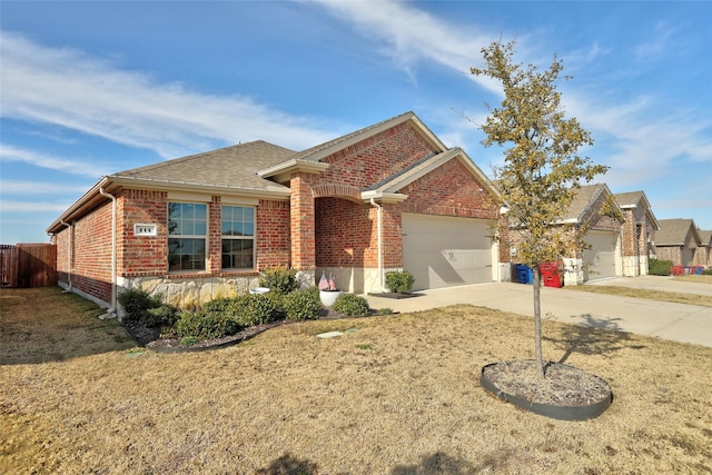 view of front of property with a garage and a front lawn