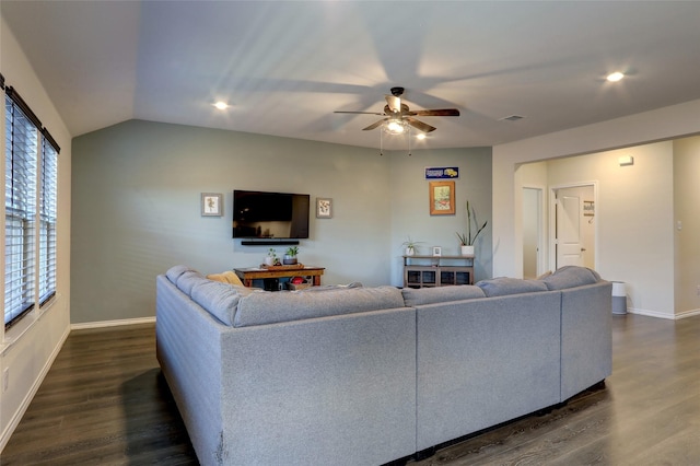 living room featuring baseboards, a ceiling fan, vaulted ceiling, and dark wood-style flooring