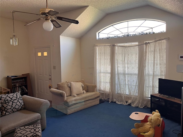 living room featuring ceiling fan, carpet, and lofted ceiling