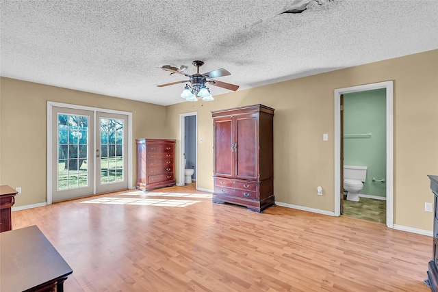 unfurnished bedroom with light wood-type flooring, ceiling fan, access to exterior, and ensuite bath