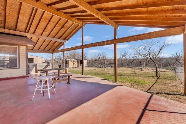 view of patio with a storage unit