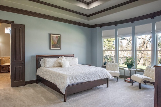 carpeted bedroom featuring ornamental molding and connected bathroom