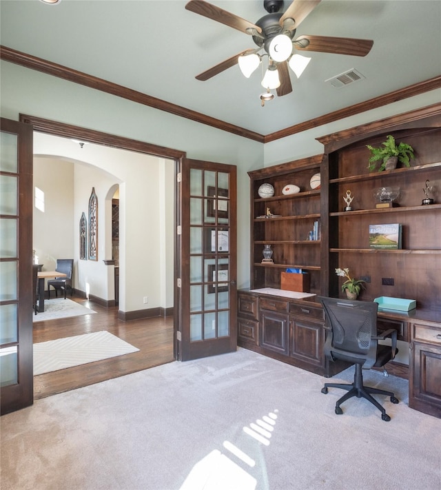 office area with light carpet, ceiling fan, ornamental molding, and french doors