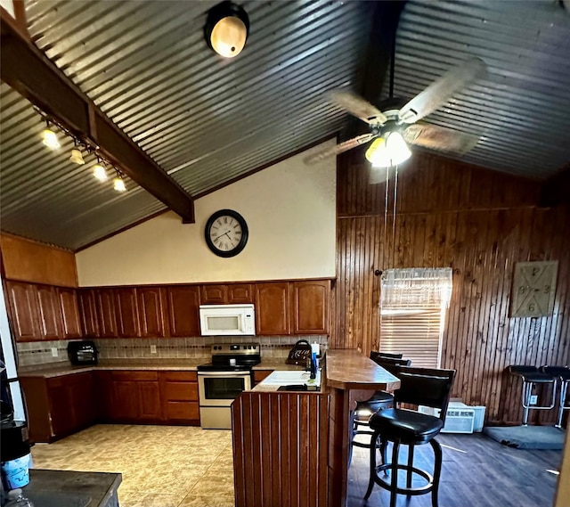 kitchen featuring beam ceiling, sink, high vaulted ceiling, stainless steel electric stove, and decorative backsplash